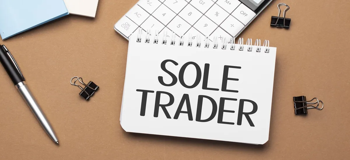 Sole trader reviewing allowable business expenses and receipts for HMRC self assessment in the UK